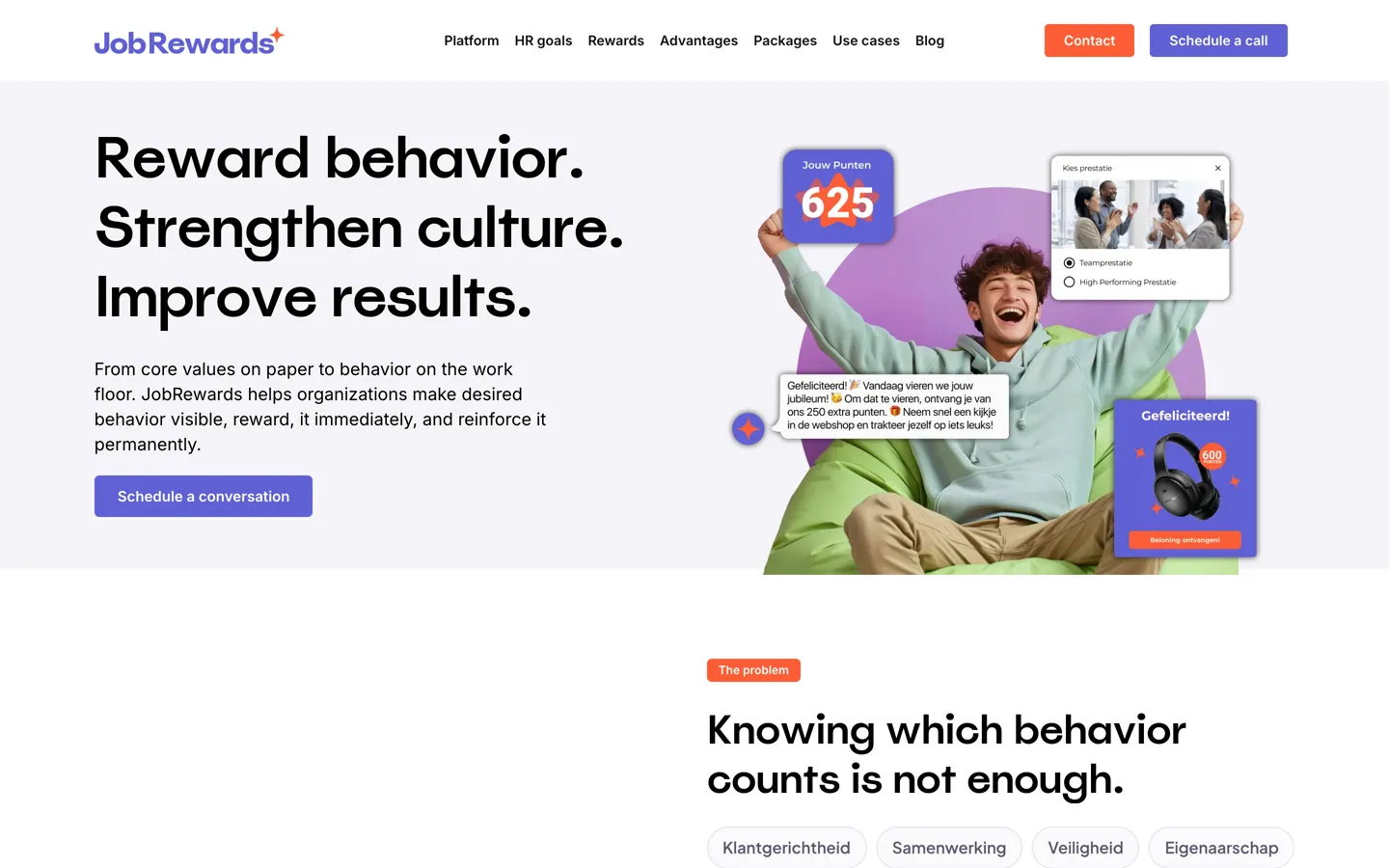 De Engelse homepage van JobRewards met de kop Reward behavior. Strengthen culture. Improve results., de knop Schedule a conversation en rechts de juichende jongen op een zitzak met een puntenteller van 625, en daaronder het begin van het blok The problem.